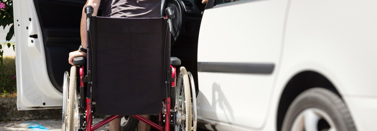 iStock 000056426418 male wheelchair entering car sm scaled