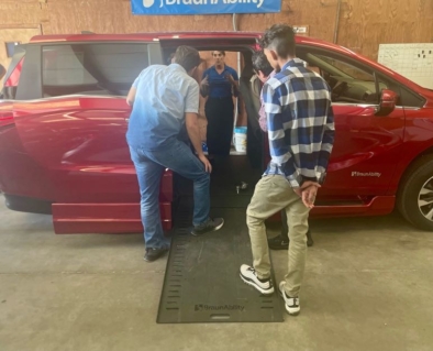 Attendees looking into an accessible van
