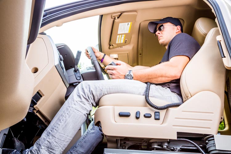 Man in driver's seat of converted truck